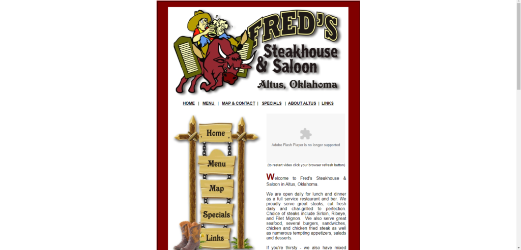 image of a webpage with a man riding a cartoon bull for a restaurant called Fred's Saloon